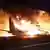 Літак Ан-26Ш Збройних сил України палає після падіння поблизу дороги в Харківській області