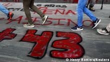 Students of the Ayotzinapa Teacher Training College walk past a +43 sign painted on the ground during a protest outside the Attorney General's office, before the sixth anniversary of the disappearance of 43 students of the college, in Mexico City, Mexico September 25, 2020. REUTERS/Henry Romero