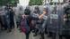 Foto de archivo de un manifestante que patea un escudo policial durante una protesta por los desaparecidos de Ayotzinapa. Foto de archivo de un manifestante que patea un escudo policial durante una protesta por los desaparecidos de Ayotzinapa.