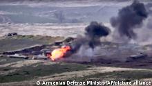 In this image taken from a footage released by Armenian Defense Ministry on Sunday, Sept. 27, 2020, Armenian forces destroy Azerbaijani military vehicle at the contact line of the self-proclaimed Republic of Nagorno-Karabakh, Azerbaijan. Fighting between Armenia and Azerbaijan has broken out around the separatist region of Nagorno-Karabakh and the Armenian Defense Ministry says two Azerbaijani helicopters have been shot down. Ministry spokeswoman Shushan Stepanyan also said Armenian forces hit three Azerbaijani tanks. (Armenian Defense Ministry via AP) |