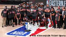 Sep 27, 2020; Lake Buena Vista, Florida, USA; Miami Heat players and staff pose for pictures after defeating the Boston Celtics in game six of the Eastern Conference Finals of the 2020 NBA Playoffs at AdventHealth Arena. Mandatory Credit: Kim Klement-USA TODAY Sports