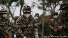 Police of the Special Force of Fight against Drug Trafficking (FELCN) prepare seized drug for its incineration in Chimore, Cochabamba department, Bolivia, on September 15, 2020. (Photo by LUIS GANDARILLAS / AFP)