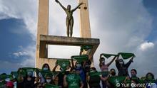 Activists raise green headscarves during a demonstration demanding the legalisation of abortion at the Constitution Square in the framework of the International Safe Abortion Day in San Salvador, on September 28, 2020. (Photo by Yuri CORTEZ / AFP)