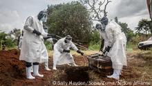 September 20, 2020, Gulu, Northern Region, Uganda: (EDITORS NOTE: Image depicts death).Health workers wearing protective suits as a precaution lower the body of a covid-19 victim for burial at a graveyard in Gulu, northern Uganda..The East African country now has more than 6,000 confirmed COVID-19 cases and more than 60 deaths. (Credit Image: © Sally Hayden/SOPA Images via ZUMA Wire |