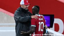LIVERPOOL, ENGLAND - SEPTEMBER 28: Jurgen Klopp, Manager of Liverpool talks to Sadio Mane during the Premier League match between Liverpool and Arsenal at Anfield on September 28, 2020 in Liverpool, England. Sporting stadiums around the UK remain under strict restrictions due to the Coronavirus Pandemic as Government social distancing laws prohibit fans inside venues resulting in games being played behind closed doors. (Photo by Laurence Griffiths/Getty Images)