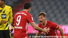 Bayern Munich's German midfielder Joshua Kimmich (R) celebrates scoring 3:2 with Bayern Munich's Polish forward Robert Lewandowski during the German Supercup football match FC Bayern Munich v BVB Borussia Dortmund in Munich, Southern Germany, on September 30, 2020. (Photo by CHRISTOF STACHE / various sources / AFP) / DFL REGULATIONS PROHIBIT ANY USE OF PHOTOGRAPHS AS IMAGE SEQUENCES AND/OR QUASI-VIDEO (Photo by CHRISTOF STACHE/AFP via Getty Images)
