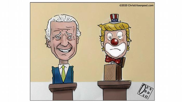 Patung Joe Biden di samping salah satu Trump dengan riasan badut (karikatur oleh Christi)
