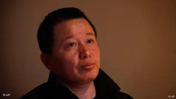 Gao Zhisheng, a human rights lawyer, pays attention to a question during his first meeting with the media since he resurfaced two weeks ago, at a tea house in Beijing, China, Wednesday, April 7, 2010. Gao, whose disappearance more than a year ago caused an international outcry, said Wednesday that he is abandoning his once prominent role as a government critic in hopes of reuniting with his family. In the meeting, Gao said he did not want to discuss his disappearance. (AP Photo/Gemunu Amarasinghe)