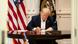 Trump at a table in a hospital conference room Trump at a table in a hospital conference room
