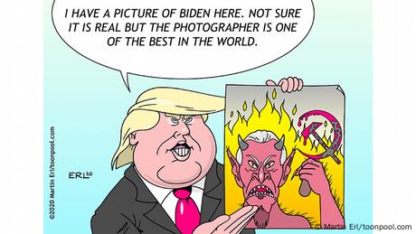 Donald Trump holds up a photo of Joe Biden depicted as a horned devil with a hammer and sickle with flames in the background (cartoon by Martin Erl / toonpool.com)