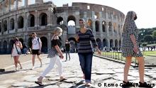 06.10.2020
People wearing face masks walk in front of the Colosseum, as local authorities in the Italian capital Rome order face coverings to be worn at all times out of doors in an effort to counter rising coronavirus disease (COVID-19) infections, in Rome, Italy October 6, 2020. REUTERS/Remo Casilli
