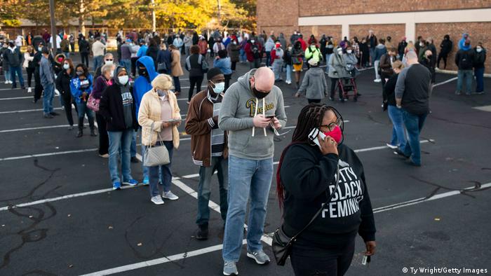 Early voters line up outside a polling station in Columbus, Ohio