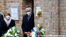 German President Frank-Walter Steinmeier and his wife Elke Buedenbender leave the synagogue at the commemoration ceremony for victims of a shooting at a synagogue and a kebab shop one year ago in Halle, Germany October 9, 2020. REUTERS/Fabrizio Bensch