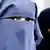 woman in full-face veil