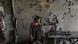 Woman inside destroyed flat, Azerbaijan Woman inside destroyed flat, Azerbaijan