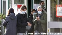 People with face masks leave a polling station to the local elections in Vienna, Austria, Sunday, Oct. 11, 2020. (AP Photo/Ronald Zak) |