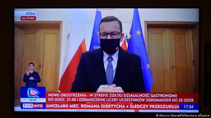 Polish Prime Minister Mateusz Morawiecki during a televised press conference