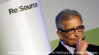 Image of Amartya Sen with a pen in his hand