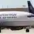 Flugzeug mit Continental-Schriftzug und im Hintergrund Heckflügel eines Flugzeugs mit United-Logo (Foto: ap)