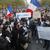 People gather in Paris with posters reading "No to barbarity" and "I'm a teacher" for a demonstration in honor of slain teacher Samuel Paty