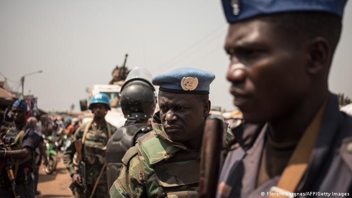 A soldier of the United Nations Multidimensional Integrated Stabilization Mission in the Central African Republic (MINUSCA) patrols with the Central African National Gendarmerie in PK5, the predominantly Muslim shopping district of Bangui