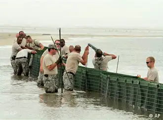 Members of the U.S. Army National Guard B Company 711 put Hesco containers along the beaches of Dauphin Island, Ala., Sunday, May 2, 2010