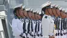 FILE - In this Jan. 17, 2019, file photo, Chinese People's Liberation Navy sailors stand in formation on the deck of a type 054A guided missile frigate Wuhu as it docks at Manila's South Harbor for a four-day port call in Manila, Philippines. U.S.-China friction has flared again, with Beijing firing back at accusations by Washington that it is a leading cause of global environmental damage and has reneged on its promise not to militarize the South China Sea. (AP Photo/Bullit Marquez) |