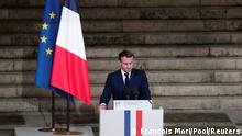 French President Emmanuel Macron delivers his speech in front of the coffin of slain teacher Samuel Paty during a national memorial event, in Paris, France October 21, 2020. Francois Mori/Pool via REUTERS