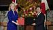 Liz Truss and Toshimitsu Motegi hold up the signed trade agreement Liz Truss and Toshimitsu Motegi hold up the signed trade agreement