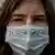 face of a woman wearing a face mask that has the words: I am Samuel