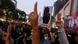 Thai protesters make a three-finger salute Thai protesters make a three-finger salute