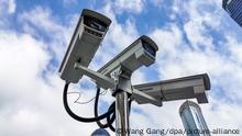28.11.2019, China, Shanghai: Many monitors produced by Hikvision, a Chinese manufacturer and the world's largest supplier of video surveillance products, are seen at local central business district with the landmark, Oriental Pearl Radio & Television Tower, as background, at the Bund, Shanghai, China, 28 November 2019. *** Local Caption *** fachaoshi Foto: Wang Gang/dpa |