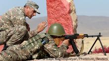 An Armenian reservist listens to instructions while undergoing training at a firing range before the departure for the front line in the course of a military conflict with the armed forces of Azerbaijan over the breakaway region of Nagorno-Karabakh, near Yerevan, Armenia October 25, 2020. Hayk Baghdasaryan/Photolure via REUTERS ATTENTION EDITORS - THIS IMAGE HAS BEEN SUPPLIED BY A THIRD PARTY.