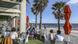 Diners are seen at a restaurant looking out towards St. Kilda Beach Diners are seen at a restaurant looking out towards St. Kilda Beach