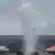 Fire engines spray water to greet the arrival of EasyJet and Lufthansa planes at Berlin's new airport