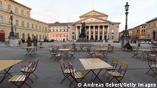 31.10.2020 *** MUNICH, GERMANY - OCTOBER 31: Empty chairs and tables stand outside a restaurant in front of the opera house where wearing masks is mandatory during the second wave of the coronavirus pandemic on October 31, 2020 in Munich, Germany. The German government recently announced that effective this coming Monday, November 2, all restaurants, bars, cultural venues, cinemas, fitness studios and sports halls must close for four weeks in an effort to rein in the skyrocketing growth in the number of daily infections that recently reached 18,000. Stores, schools and day care centers will remain open. (Photo by Andreas Gebert/Getty Images)
