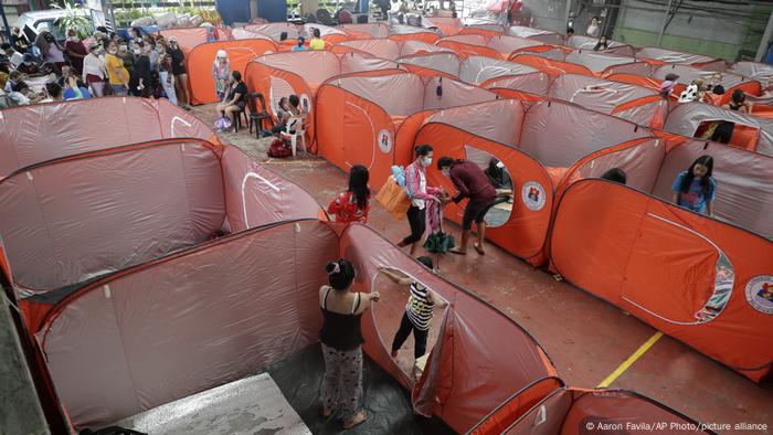 Residents occupy an evacuation center in Manila as Typhoon Goni hits the Philippines