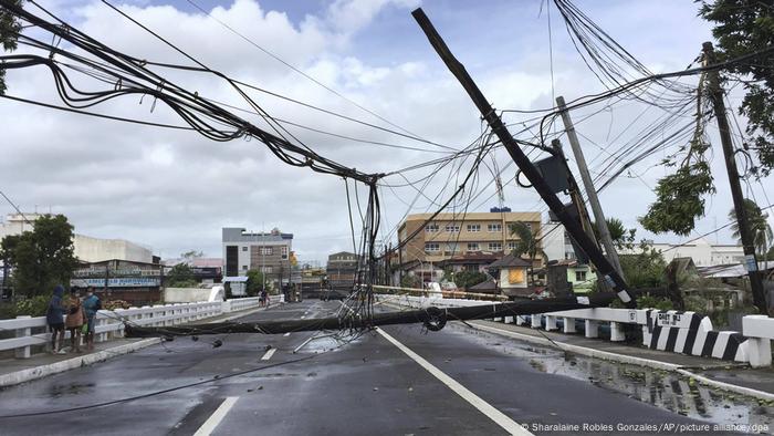 Powerlines lay in the road after being toppled during Typhoon Goni