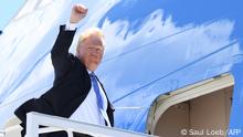 US President Donald Trump boards Air Force One prior to departure from Canadian Forces Base Bagotville in Canada, June 9, 2018. - Trump travels to Singapore to meet with North Korean leader Kim Jong Un on June 12. (Photo by SAUL LOEB / AFP)