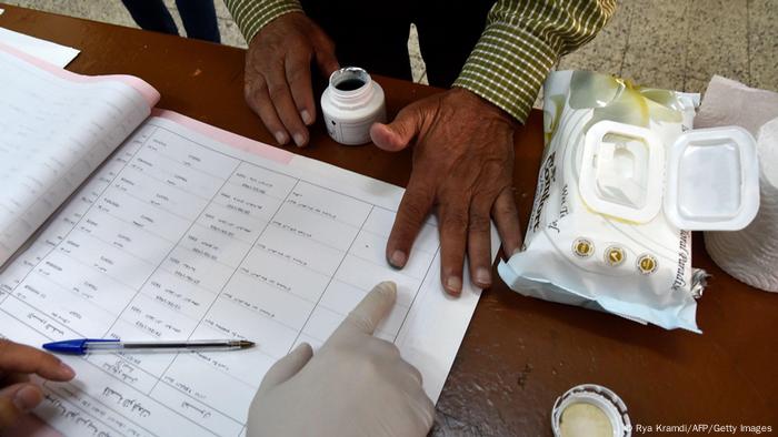 A man in Algeria votes in the constitution referendum