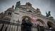 A policeman with a gun stands guard outside the Notre-Dame Basilica in Nice A policeman with a gun stands guard outside the Notre-Dame Basilica in Nice