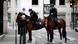 Police officers on horses conduct a control to check exemption certificates and verify identity on the Champs-Elysee avenue Police officers on horses conduct a control to check exemption certificates and verify identity on the Champs-Elysee avenue