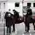 Police officers on horses conduct a control to check exemption certificates and verify identity on the Champs-Elysee avenue