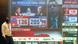 Masked man walks past screen showing US elections numbers in Mumbai Masked man walks past screen showing US elections numbers in Mumbai