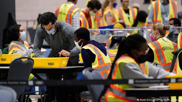 Philadelphia election workers process mail-in and absentee ballots for the general election,