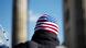A man with a US flag hat at a rally in Berlin, Germany A man with a US flag hat at a rally in Berlin, Germany