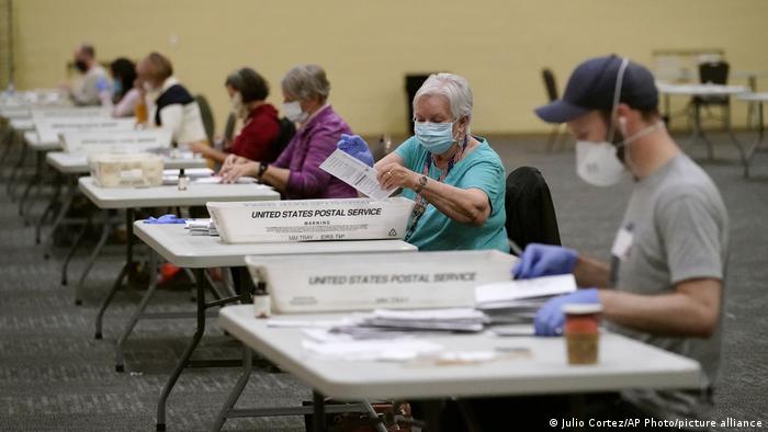 Workers prepare mail-in ballots for counting in Pennsylvania