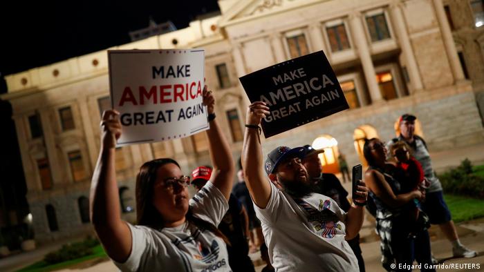 Trump supporters protest outside of the Arizona State Capitol Building to protest the early results of the 2020 presidential election, in Phoenix, Arizona. 