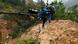 Two men crossing a mud hill after a mudslide in Guatemala Two men crossing a mud hill after a mudslide in Guatemala