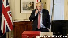 25/03/2020. London, United Kingdom. Boris Johnson Covid-19 25/03. The Prime Minister Boris Johnson on the telephone in his office in No10 Downing Street, to Her Majesty The Queen for her weekly Audience during the coronavirus . |